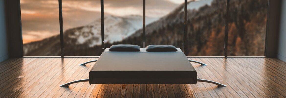 Black bed on a hardwood floor