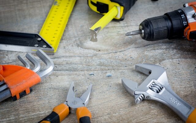Variety of tools on a wooden surface