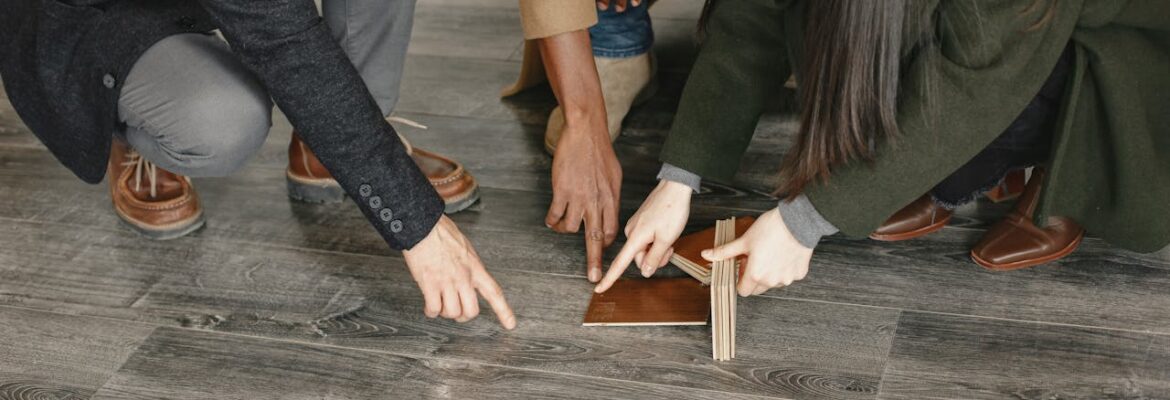 People pointing at the floor